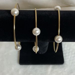 Set of 3 gold tone and faux pearl bangle bracelets